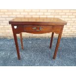 A mahogany fold top tea table with friez