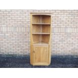 An Ercol corner cabinet measuring approx