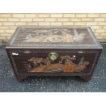 Asian camphor wood coffer with carved de