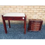 A hinge top piano stool, 51 cm (h) and a