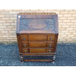 An oak fall front writing bureau with ca