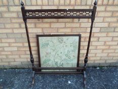 A mahogany and needlework fire screen, a