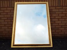 A large bevel edge wall mirror, approxim