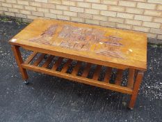 An Oriental coffee table with carved dec