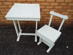 A white painted traditional school desk