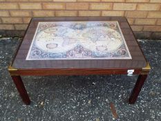 A coffee table with map image to the top