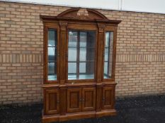 A large display cabinet with four door l