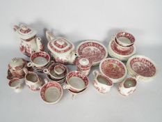A collection of pink transfer printed dinner and tea wares, predominantly Spode Pink Tower pattern.