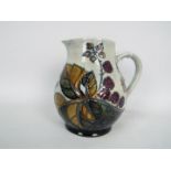 Moorcroft - A Moorcroft Pottery jug decorated in the Bramble pattern,