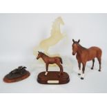 Royal Doulton - a Royal Doulton Adventure racing horse on a plinth (15 cm in height),