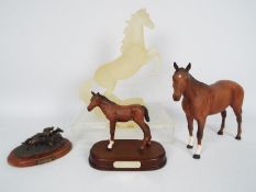 Royal Doulton - a Royal Doulton Adventure racing horse on a plinth (15 cm in height),