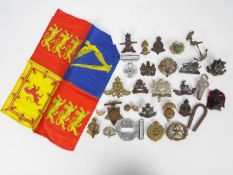 A collection of military cap badges, buttons and similar to include Notts & Derby, Cheshire,