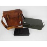 A World War Two (WWII / WW2) type leather despatch or ammunition bag and two vintage cash tins.
