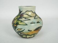 Moorcroft - A small Moorcroft Pottery vase of squat form decorated in the Islay pattern,