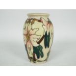 Moorcroft - A small Moorcroft Pottery vase decorated in the Blakeney Mallow pattern,