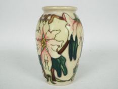 Moorcroft - A small Moorcroft Pottery vase decorated in the Blakeney Mallow pattern,
