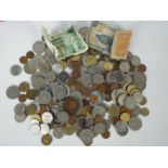 A collection of UK and foreign coins and banknotes