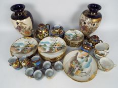 A collection of Japanese tea ware and a pair of vases, approximately 26 cm (h).