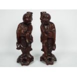 Two Chinese hardwood carvings, approximately 37 cm (h).