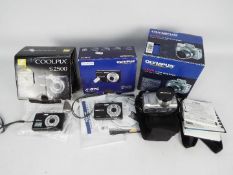 Three boxed cameras to include Nikon Coolpix S2500, Olympus X-875 and Olympus C-765 Ultra Zoom.