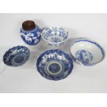 A collection of Chinese blue and white ceramics comprising four bowls and a ginger jar,