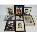 A collection of framed images of actors, predominatly bearing signatures to include Robert De Niro,