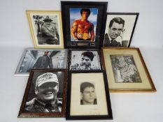 A collection of framed images of actors, predominatly bearing signatures to include Robert De Niro,