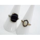 Two silver stone set dress rings,