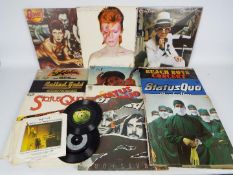 A collection of predominantly 12" vinyl records to include David Bowie, Elton John, Bob Dylan,