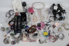 Costume Jewellery - five bags containing rings, necklaces, paired earrings and bracelets,