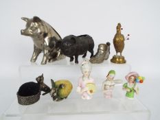 A quantity of pin cushions, Victorian and later to include animal form examples,