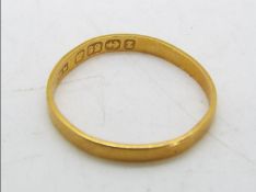 A 22 carat gold wedding band, Birmingham hallmark, size N+ ½, approx 1.