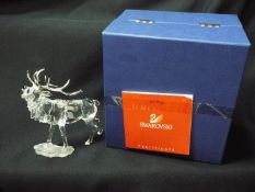 Swarovski - A boxed model of a stag with silvered antlers designed by Adi Stocker, with certificate.