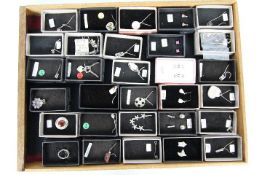 Costume Jewellery - a display case containing sterling silver necklaces and paired earrings