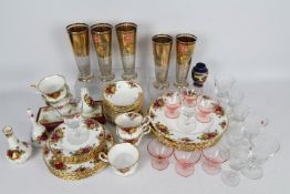 A quantity of Royal Albert Old country Roses dinner and tea wares, plates, cups,