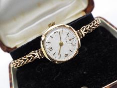 A lady's 9 carat gold cased wristwatch, subsidiary seconds dial,