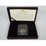 A coin presentation pack by CPM, comprising an encapsulated King Edward VII 1902 Silver Crown,