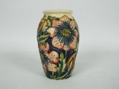 Moorcroft - A small Moorcroft Pottery vase decorated in the Pheasant's Eye pattern,