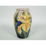 Moorcroft - A small Moorcroft Pottery vase decorated in the Windrush pattern, approximately 10.