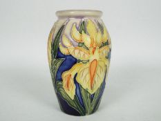 Moorcroft - A small Moorcroft Pottery vase decorated in the Windrush pattern, approximately 10.