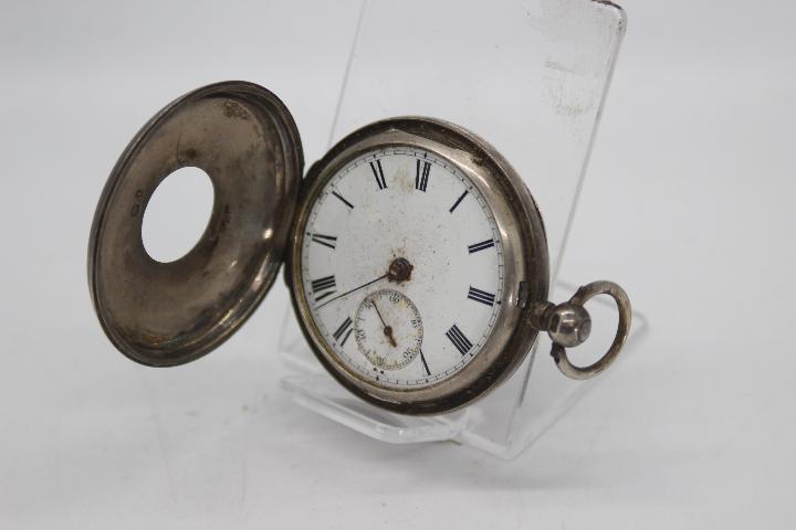 A Victorian silver cased half hunter pocket watch, the case of London assay 1866,