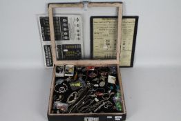 Costume Jewellery - a display case containing a quantity of costume jewellery predominantly silver