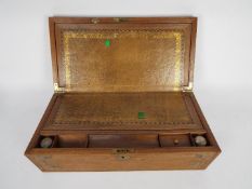 A William IV style writing slope or lap desk with inlaid brass work,