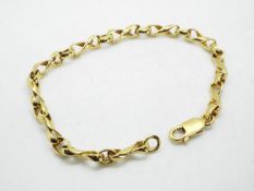 A yellow metal chain marked 750 (18 carat gold), approx 18.5 cm (length), approx 13.