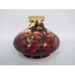 Moorcroft - A Moorcroft Pottery vase of squat form, decorated in the Pasque Flower pattern,