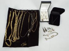 Costume jewellery to include gold plated necklaces, a fine trace chain stamped 375 (9ct),