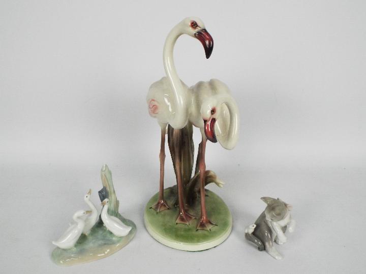 An Austrian ceramic group of two flamingos, marked to the base Wien Keramos,