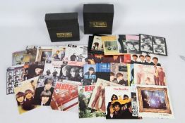 The Beatles - Two compact disc box sets comprising The Singles Collection and The EP Collection.