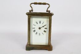 A French brass and glass Corniche styled case carriage timepiece clock,
