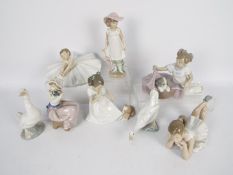 A collection of Nao figurines, children, animals, ballerinas, largest approximately 20 cm (h).